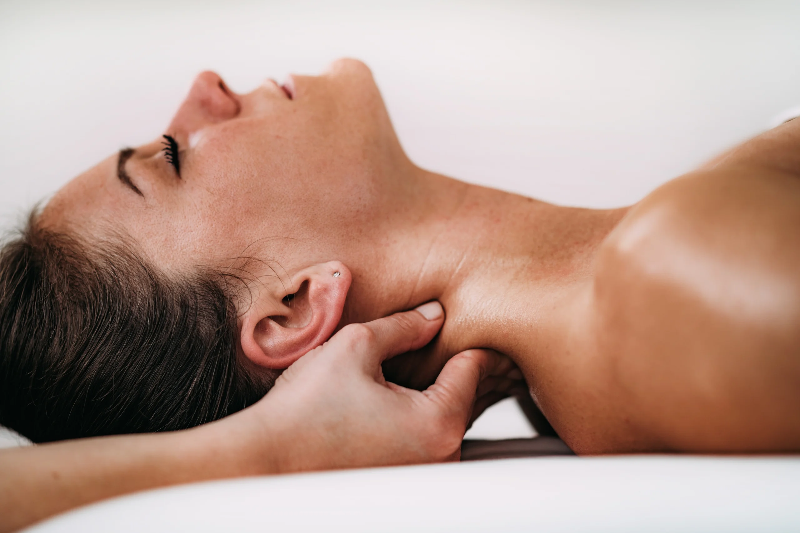 A woman getting a neck massage